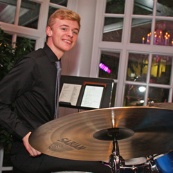 Retrospect Band drummer Dominic playing in the Colonnade Room at a downtown DC wedding
